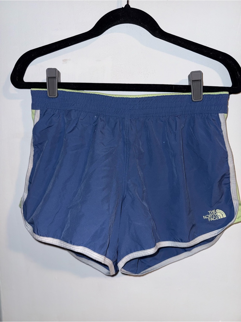 North face running shorts in blue and green